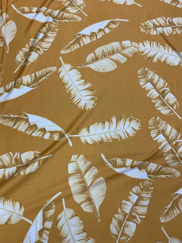 Last Chance White leaves on a Mustard Background Printed Polyester Fabric