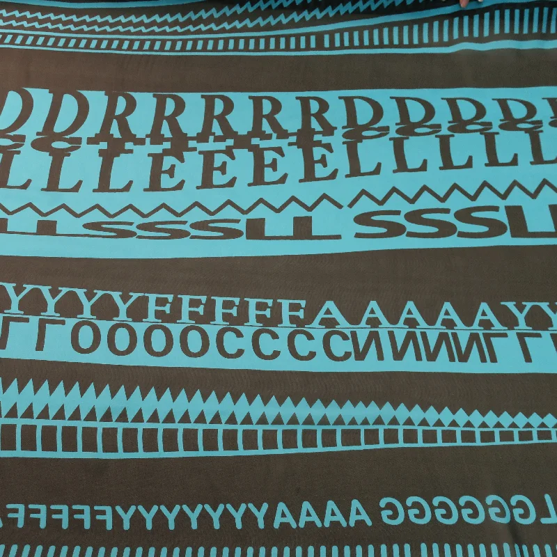 Act Now Turquoise Letters with Black Background Printed Silk Chiffon Fabric